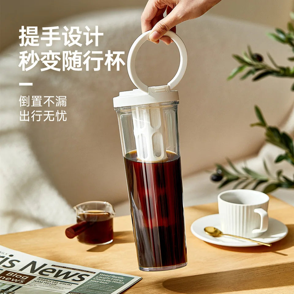 PP cold brew coffee maker with a handle, shown in an outdoor setting (view 2)
