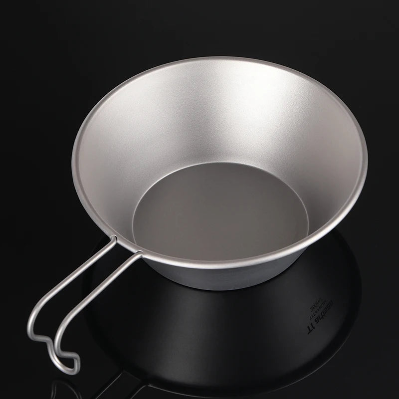 A single 260ml titanium camping bowl with a fixed handle, shown from an overhead angle. (view 4)