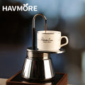 Aluminum French press coffee maker in a camp setting