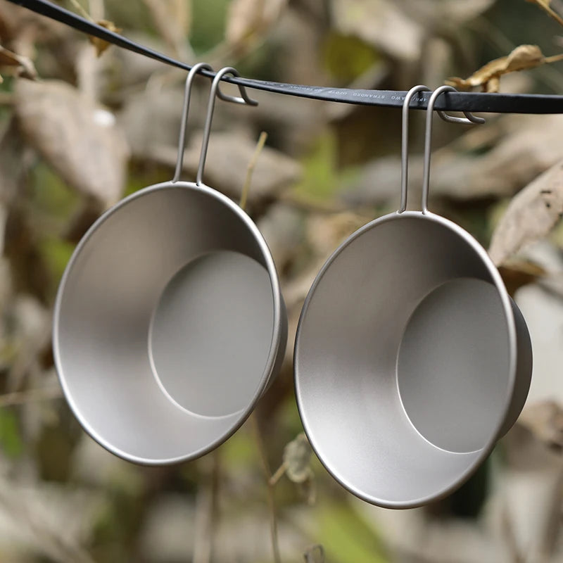 A single 260ml titanium camping bowl with a fixed handle, shown from an overhead angle. (view 2)