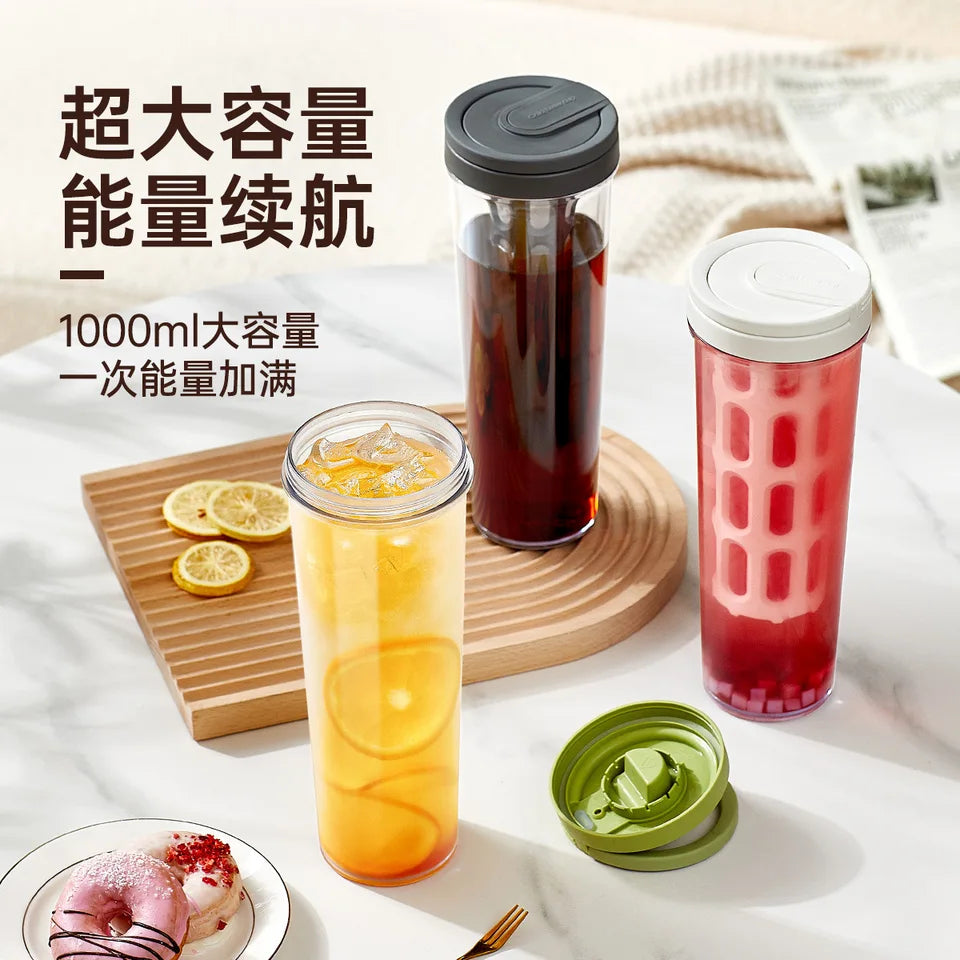 PP cold brew coffee maker with a handle, shown in an outdoor setting (view 3)