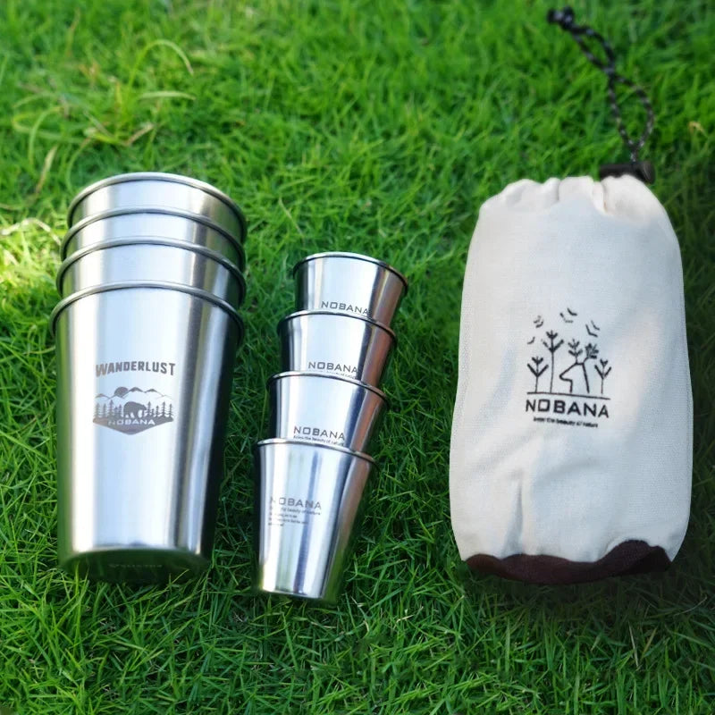 A stack of 304 stainless steel camp cups in an outdoor setting (view 4)