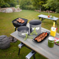 Hard aluminum alloy camping cookware set in orange and green, including pots and a frying pan, suitable for 1-2 people.