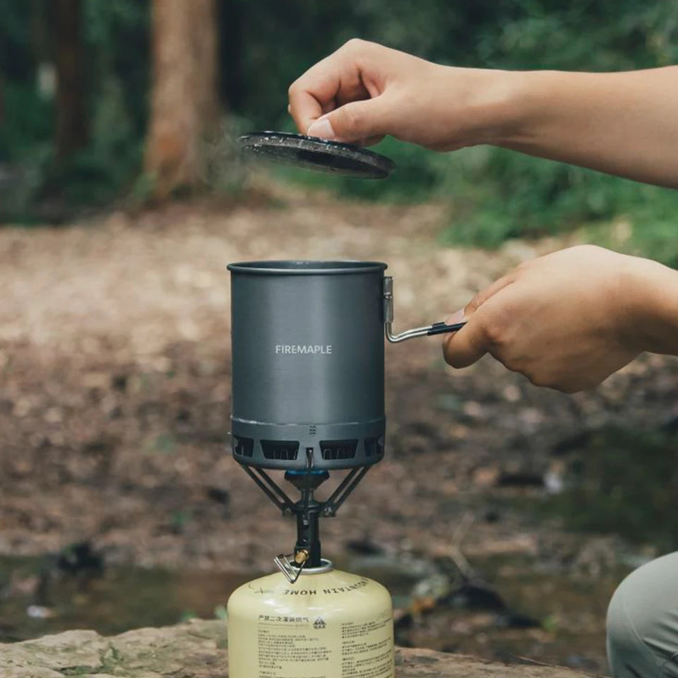 An ultralight aluminum alloy camping pot with a black neoprene sleeve and a plastic handle, shown on (view 6)