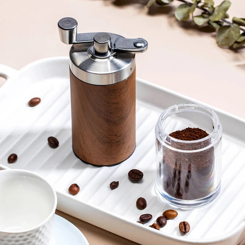 Portable stainless steel hand-crank coffee grinder with a wood grain finish (view 5)