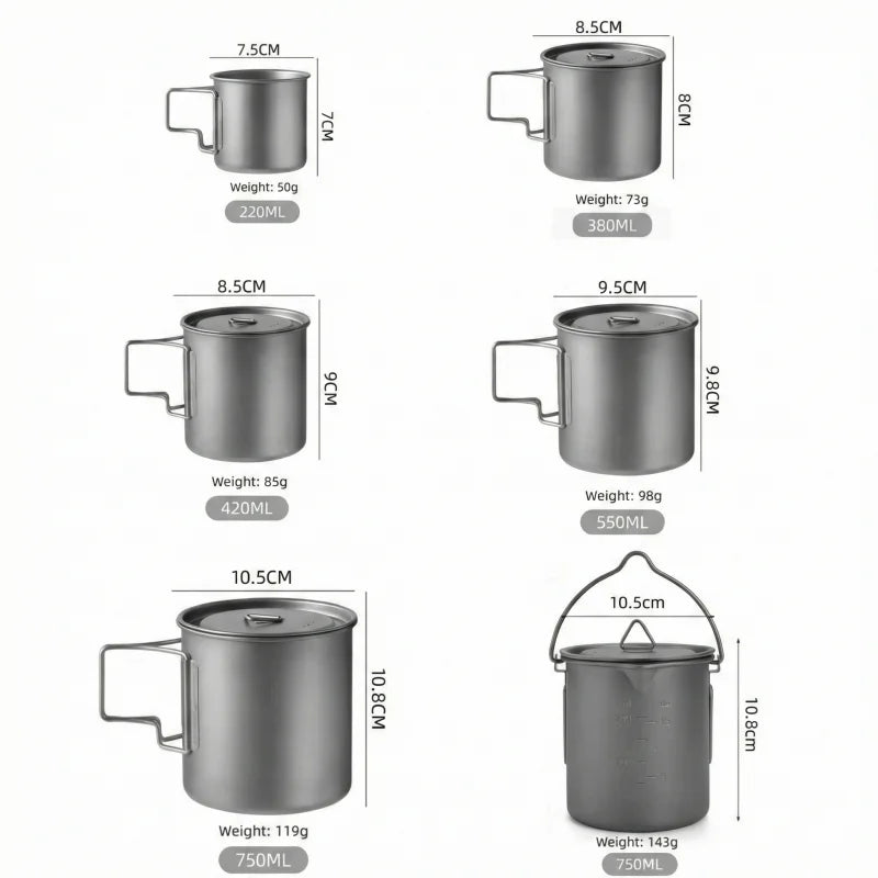 Titanium camping mug with a folding handle, shown in an outdoor setting (view 2)