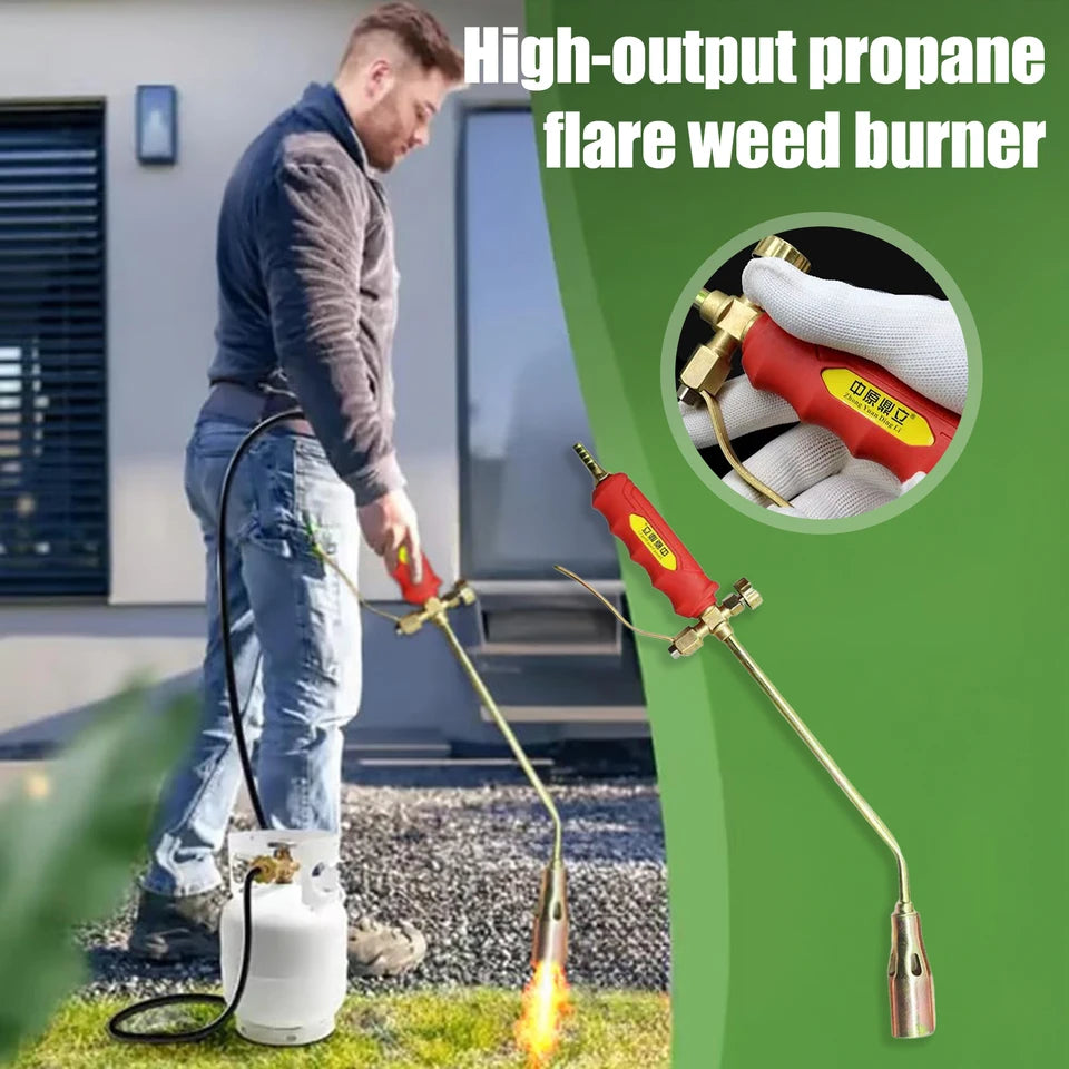 Close-up of a portable manual igniter with a gas hose attachment, shown in an outdoor setting (view 3)