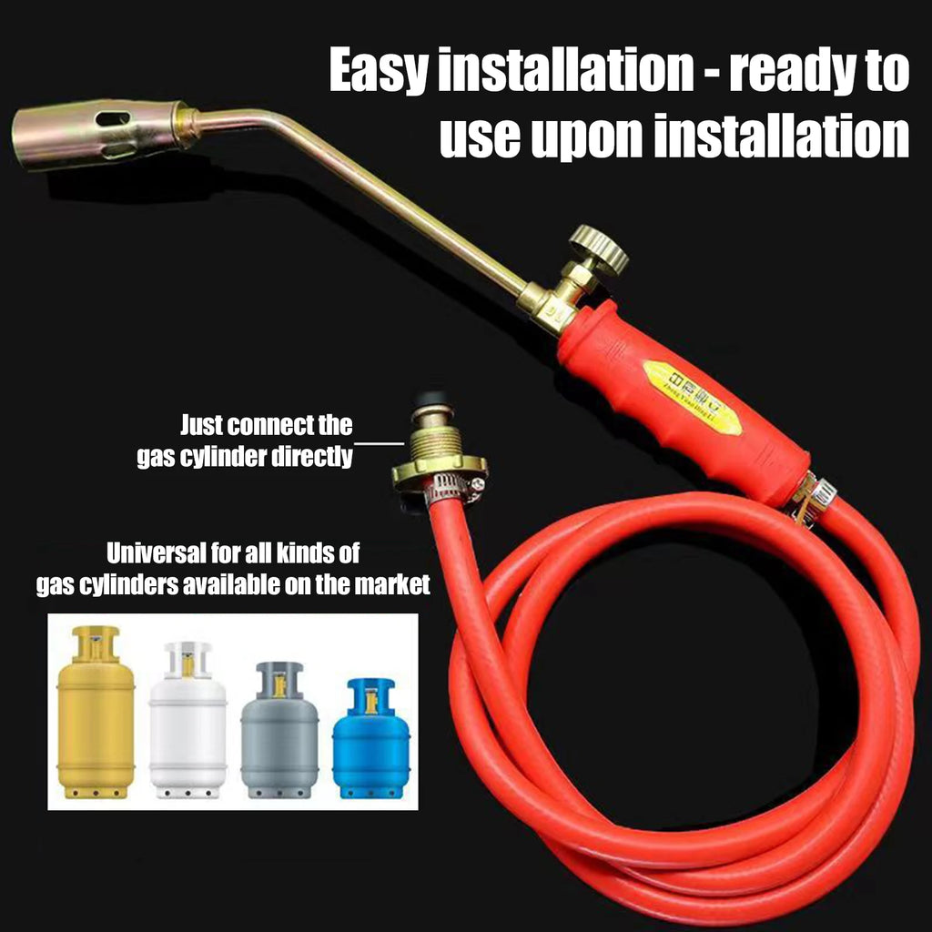 Close-up of a portable manual igniter with a gas hose attachment, shown in an outdoor setting (view 7)