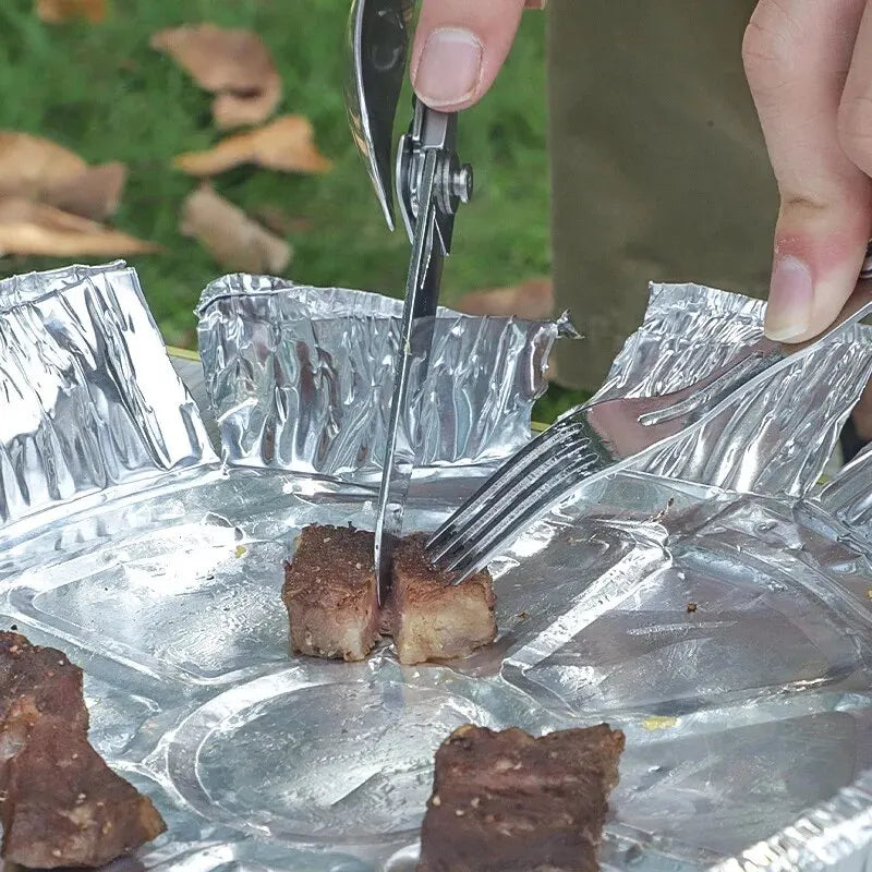 White stainless steel folding cutlery set, including a knife, fork, and spoon, shown in a compact fo (view 3)