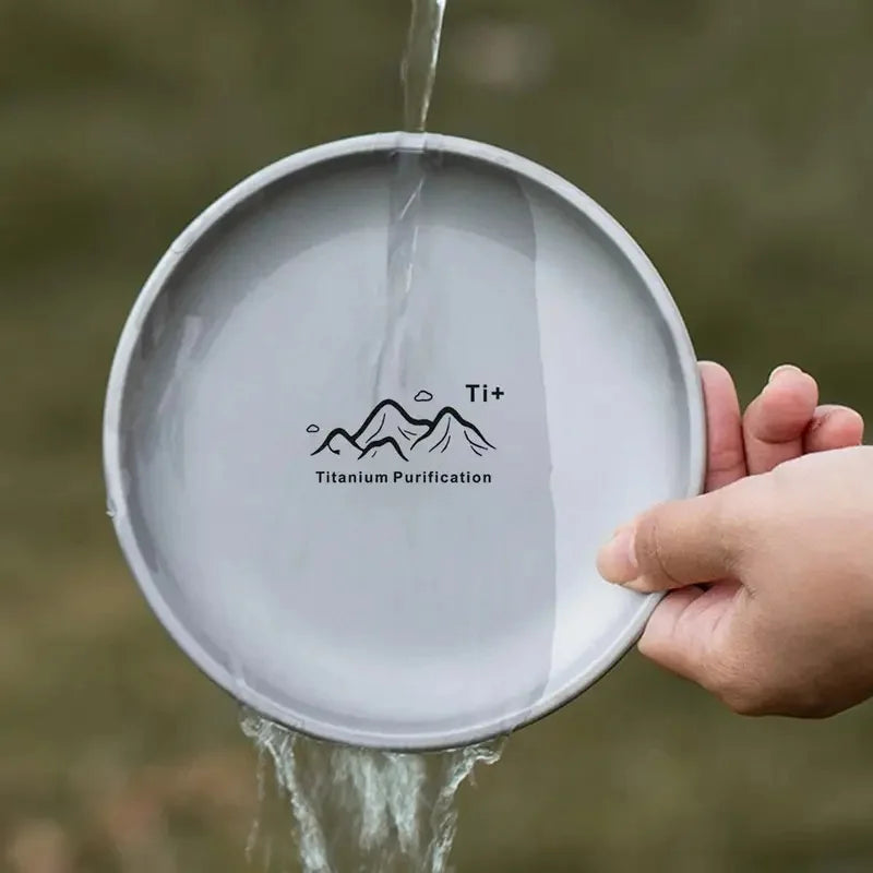 Single round titanium camping plate on a neutral background (view 7)