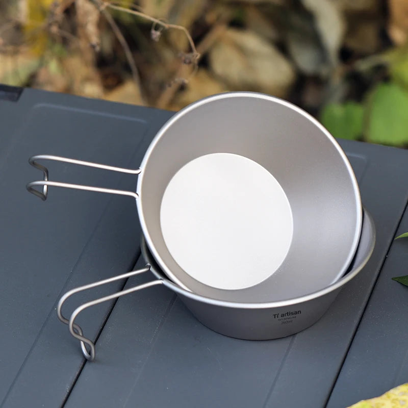 A single 260ml titanium camping bowl with a fixed handle, shown from an overhead angle. (view 3)