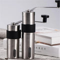Portable stainless steel manual coffee grinder with handle and clear base