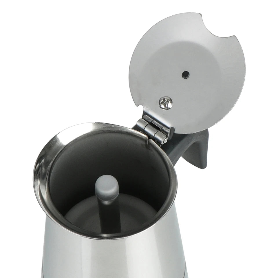 Stainless steel moka pot on a stovetop with coffee pouring into the upper chamber (view 6)