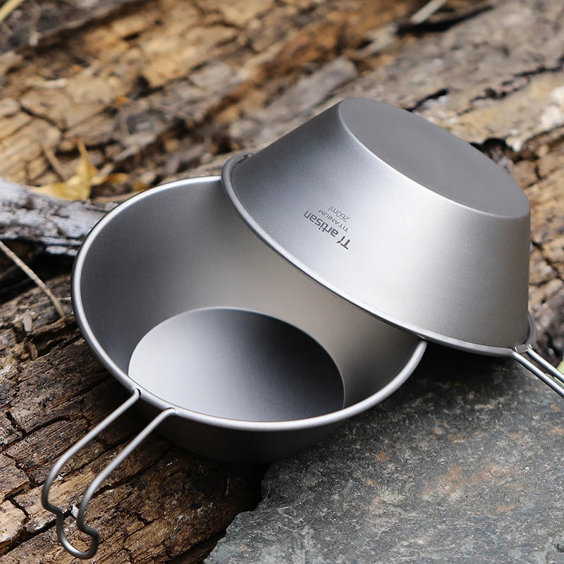 A single 260ml titanium camping bowl with a fixed handle, shown from an overhead angle. (view 7)