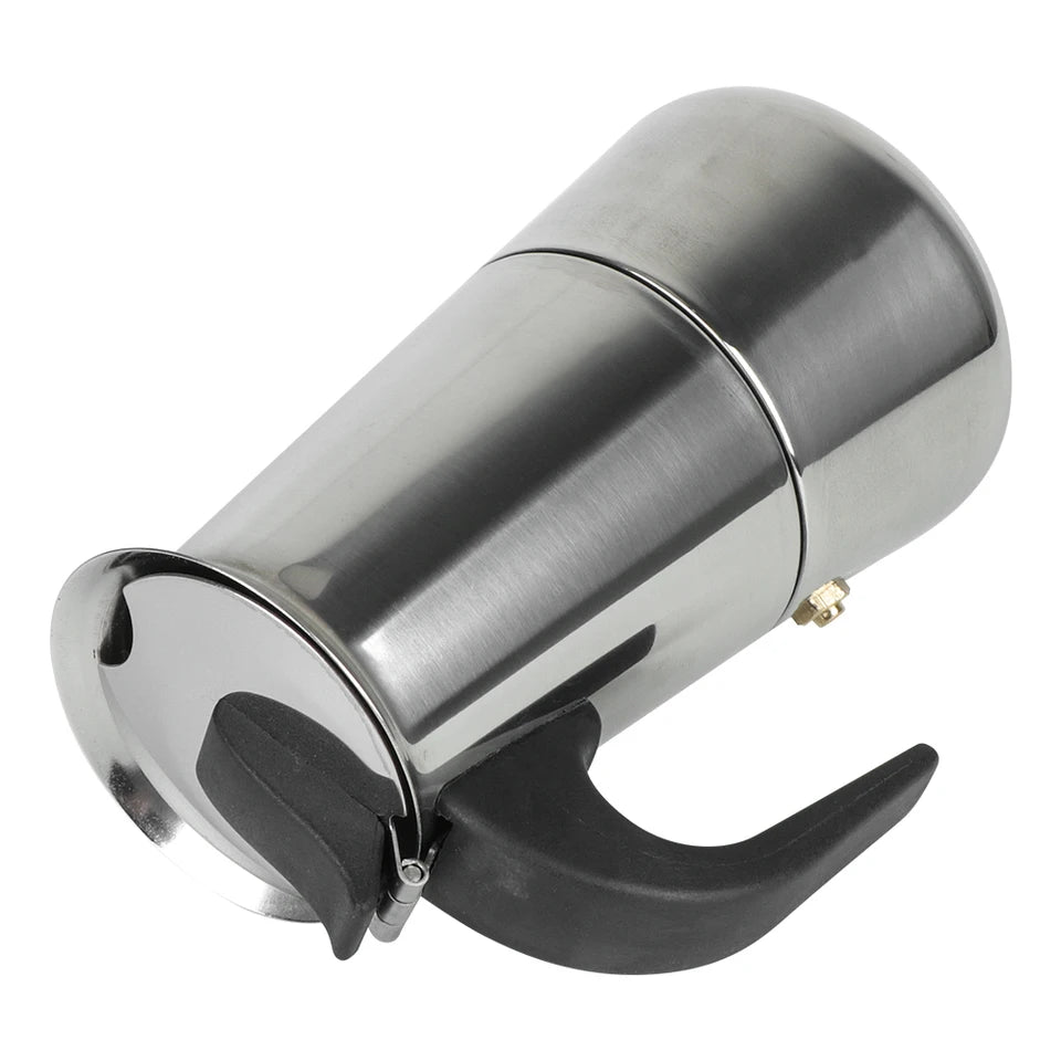 Stainless steel moka pot on a stovetop with coffee pouring into the upper chamber (view 3)