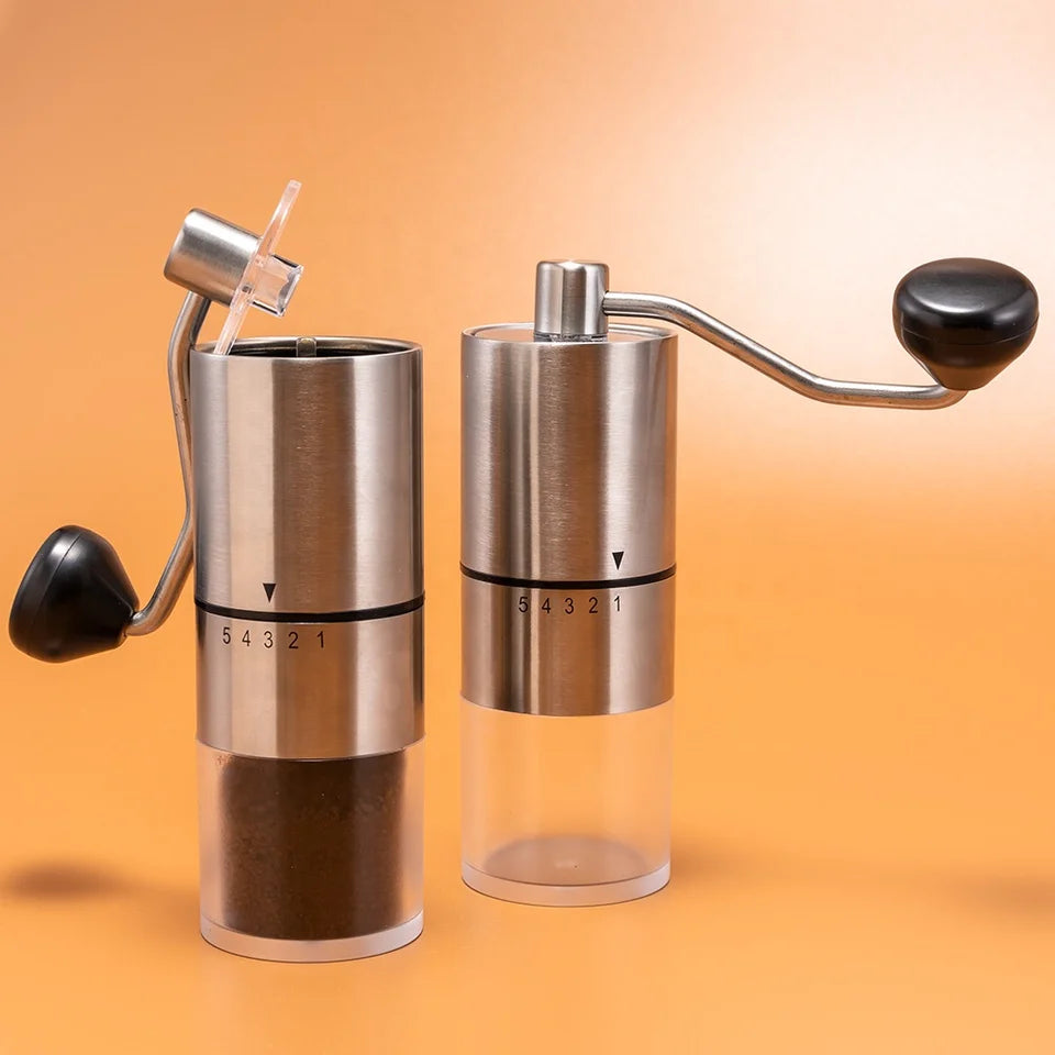 Portable hand-crank coffee grinder made of stainless steel with a black handle (view 5)